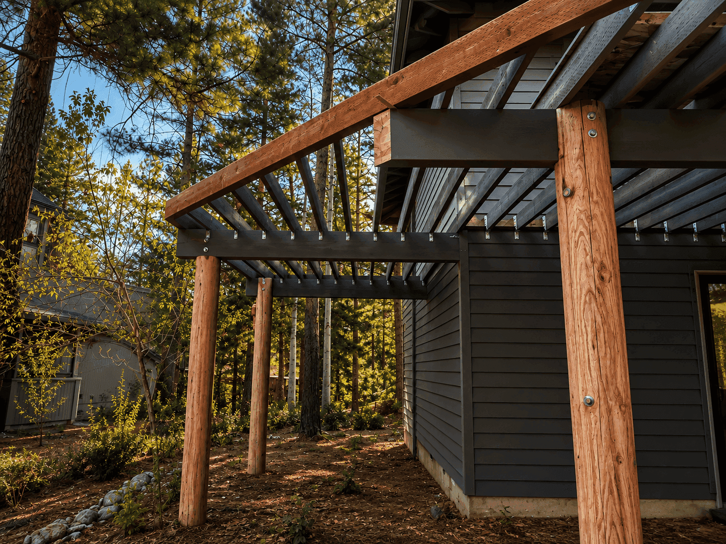 Structural screws and joist hangers securing a beam-to-post connection on a Central Oregon deck