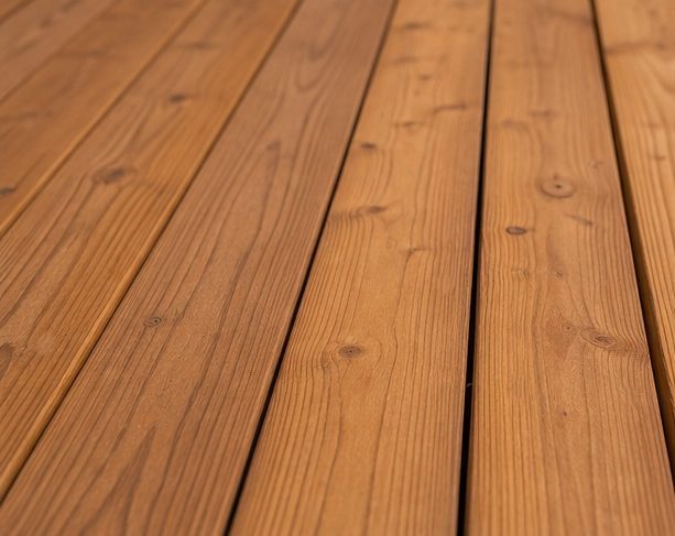 Warm-toned cedar deck boards up close