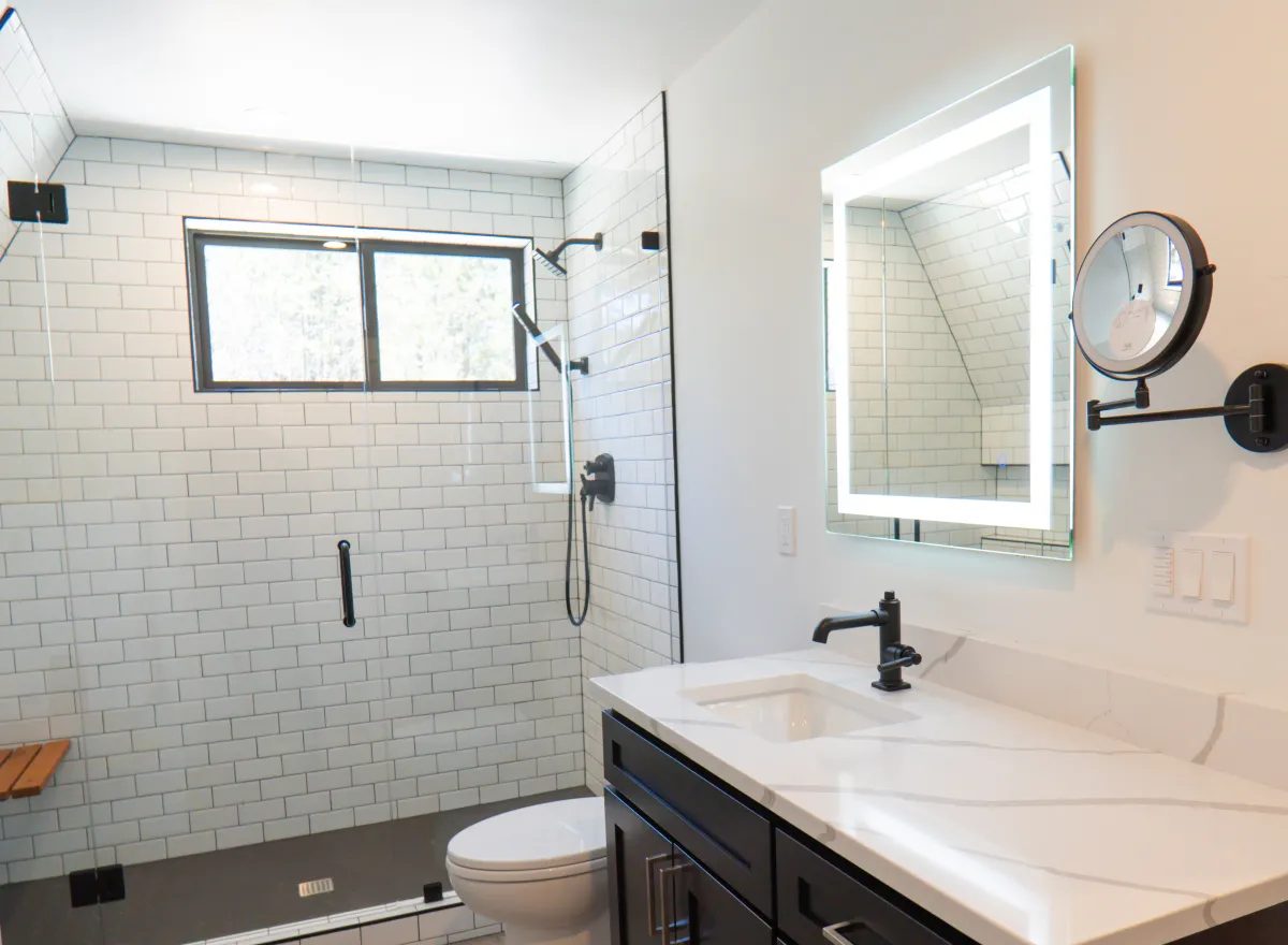 Tiled walk-in shower in remodeled bathroom